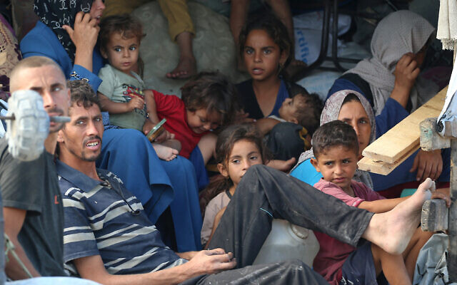 Palestinians sit in the back of a truck as they transport their belongings while evacuating Gaza City towards southern areas of the coastal Gaza Strip, on September 10, 2025. (Eyad Baba/AFP) Palestinians sit in the back of a truck as they transport their belongings while evacuating Gaza City towards southern areas of the coastal Gaza Strip, on September 10, 2025. (Eyad Baba/AFP)