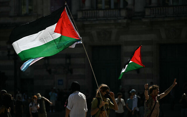 Protesters hold Palestinian flags during a demonstration as part of the "Bloquons tout" ("Let's block everything") protest movement, in Montpellier, southern France, on September 10, 2025. (Photo by Gabriel BOUYS / AFP)