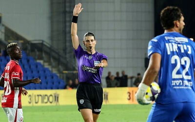 Israeli referee Sapir Berman, 31, the first transgender woman to judge an international soccer match, signals during an Israeli Premier League game between Maccabi Netanya and Hapoel Beersheba, in Netanya, on August 24, 2025. (JACK GUEZ / AFP)