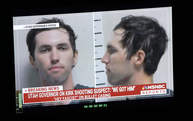 A TV monitor displays a picture of Tyler Robinson, the suspected of killing Charlie Kirk on September 11, in Orem, Utah, on September 12, 2025. (Photo by Patrick T. Fallon / AFP)