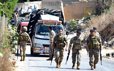 Lebanese army soldiers stand guard as a truck loaded with weapons leaves the Palestinian refugee camp of Beddawi, near the northern city of Tripoli on September 13, 2025 (Fathi Al-Masri / AFP) Lebanese army soldiers stand guard as a truck loaded with weapons leaves the Palestinian refugee camp of Beddawi, near the northern city of Tripoli on September 13, 2025 (Fathi Al-Masri / AFP)