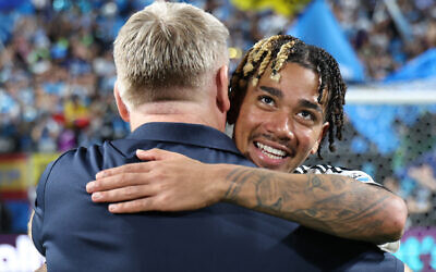 Idan Toklomati #17 of Charlotte FC hugs Dean Smith, head coach of Charlotte FC, after the MLS match between Charlotte FC and Inter Miami CF at Bank of America Stadium on September 13, 2025 in Charlotte, North Carolina.  (David Jensen / GETTY IMAGES NORTH AMERICA / Getty Images via AFP)