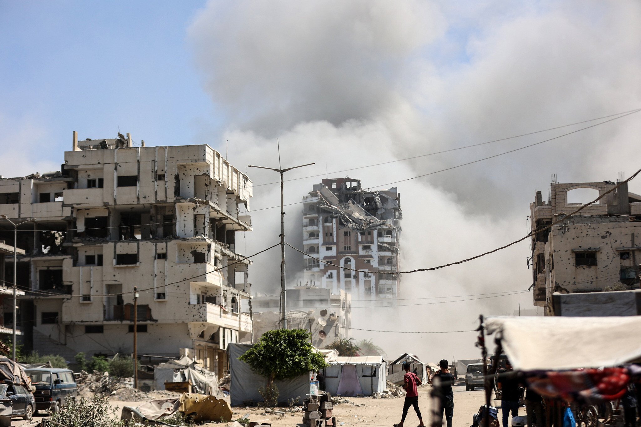 NextImg:Israel levels three towers in Gaza City as residents continue to evacuate area