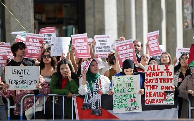 Anti-Israel protesters hold banners reading 'Israel = terrorism,' prior to the 21st and last stage of the Vuelta a Espana 2025, a 101 kilometer (nearly 63 miles) race between Alalpardo and Madrid, in Madrid on September 14, 2025. (Thomas Coex/AFP) Anti-Israel protesters hold banners reading 'Israel = terrorism,' prior to the 21st and last stage of the Vuelta a Espana 2025, a 101 kilometer (nearly 63 miles) race between Alalpardo and Madrid, in Madrid on September 14, 2025. (Thomas Coex/AFP)