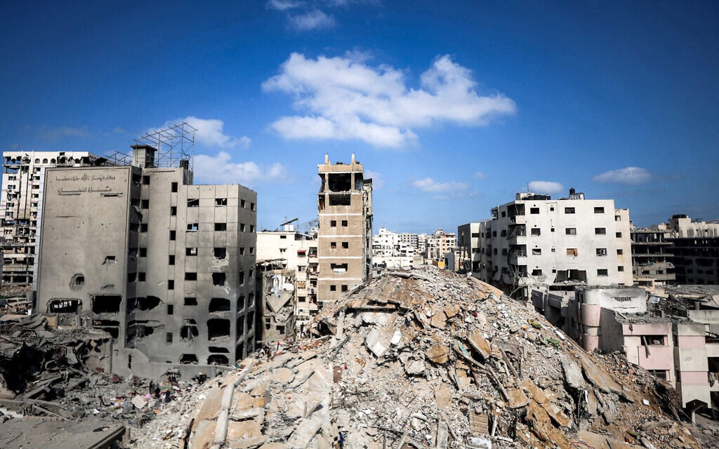 A mound of rubble is seen at the site of a Gaza City high-rise building toppled the night before, on September 15, 2025.(Omar AL-QATTAA / AFP)