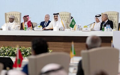 This handout picture released by the Qatar News Agency (QNA) shows Qatar's Emir Sheikh Tamim bin Hamad Al-Thani (C) chairing the 2025 Arab-Islamic emergency summit in Doha on September 15, 2025. (Qatar News Agency / AFP)
