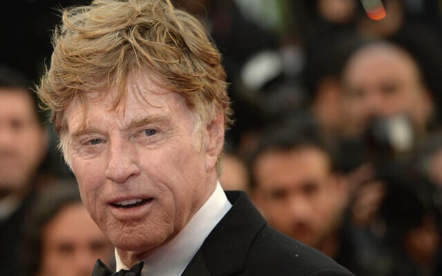US actor and director Robert Redford poses on May 22, 2013, during a photocall for the film "All is Lost" presented Out of Competition at the 66th edition of the Cannes Film Festival in Cannes (Photo by Anne-Christine POUJOULAT / AFP)