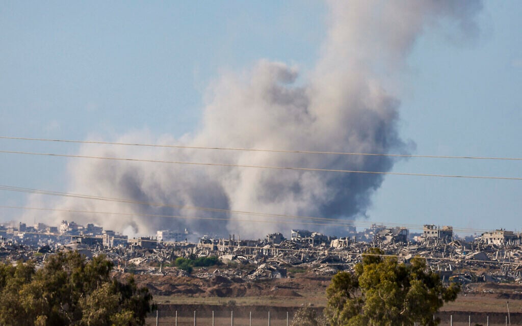 This picture taken from a position at Israel's border with the Gaza Strip shows smoke billowing amid Israeli strikes  on September 16, 2025 (Photo by Menahem Kahana / AFP)