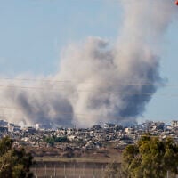 This picture taken from a position at Israel's border with the Gaza Strip shows smoke billowing amid Israeli strikes  on September 16, 2025 (Photo by Menahem Kahana / AFP)