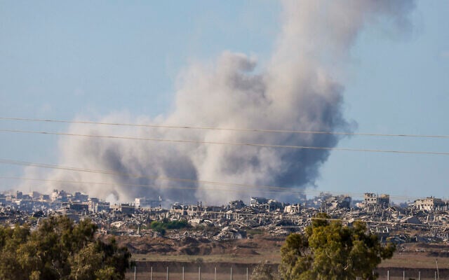 This picture taken from a position at Israel's border with the Gaza Strip shows smoke billowing amid Israeli strikes  on September 16, 2025 (Photo by Menahem Kahana / AFP)