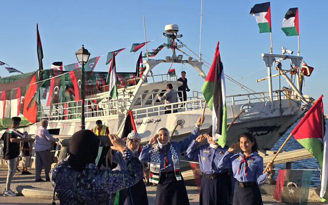 Libyan girl scouts pose for a picture in front of the Omar al-Mukhtar ship, a Libyan ship setting sail on September 17 to join the Global Sumud Flotilla, at the port in Tripoli on September 16, 2025. (Mahmud Turkia / AFP) Libyan girl scouts pose for a picture in front of the Omar al-Mukhtar ship, a Libyan ship setting sail on September 17 to join the Global Sumud Flotilla, at the port in Tripoli on September 16, 2025. (Mahmud Turkia / AFP)