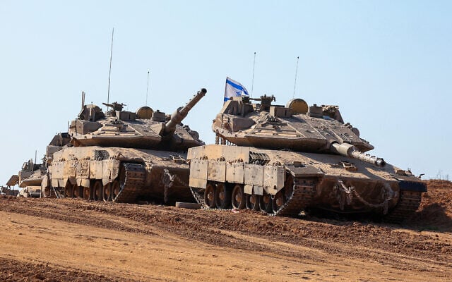 This picture taken from a position at Israel's border with the Gaza Strip shows Israeli troops deployed near the border fence on September 17, 2025. I(Photo by Jack GUEZ / AFP)