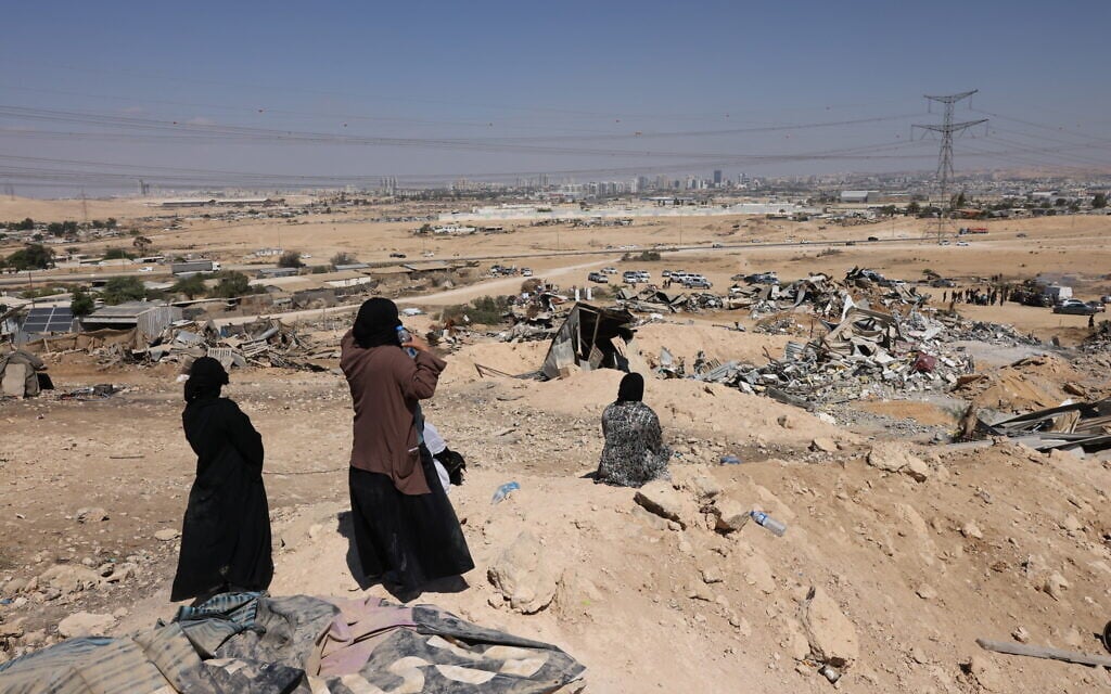 Bedouin women look at housing structures demolished by Israeli forces in the unrecognized village of as-Sir in the Negev desert in southern Israel on September 17, 2025. (AHMAD GHARABLI / AFP) Bedouin women look at housing structures demolished by Israeli forces in the unrecognized village of as-Sir in the Negev desert in southern Israel on September 17, 2025. (AHMAD GHARABLI / AFP)