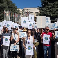 Employees of United Nations agencies hold placards in front of the UN Offices Geneva, on September 18, 2025, to honor the memory of the 370 UN employees killed in Gaza, calling for the end to the Israel-Hamas war. (Elodie Le Maou/AFP)