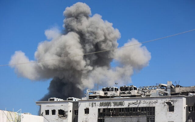 Smoke billows amid Israeli strikes on the al-Shati camp, west of Gaza City, on September 18, 2025. (Omar ak-Qattaa/AFP)