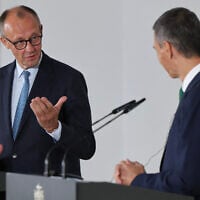 German Chancellor Friedrich Merz (L) attends a joint press conference with Spain's Prime Minister Pedro Sanchez at the Moncloa Palace in Madrid on September 18, 2025. (Thomas Coex/AFP)