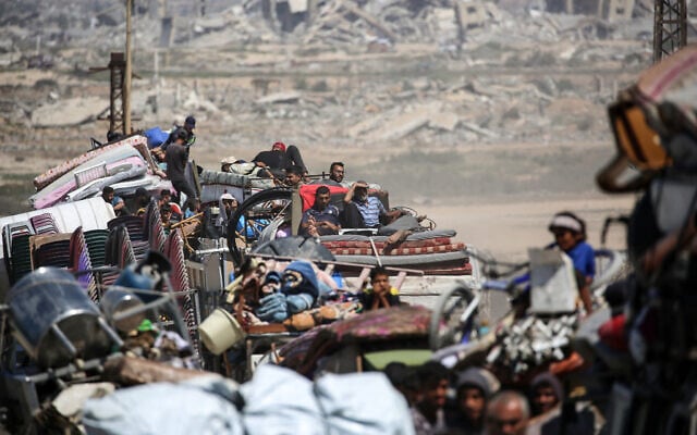 Palestinians from Gaza City move southwards with their belongings, on the coastal road near the Nuseirat refugee camp in the central Gaza Strip, on September 19, 2025. (Eyad Baba/AFP) Palestinians from Gaza City move southwards with their belongings, on the coastal road near the Nuseirat refugee camp in the central Gaza Strip, on September 19, 2025. (Eyad Baba/AFP)