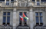 Officials attend a flag raising ceremony of the Palestinian flag outside Saint-Denis town hall, near Paris, on September 22, 2025. (STEPHANE DE SAKUTIN / AFP)