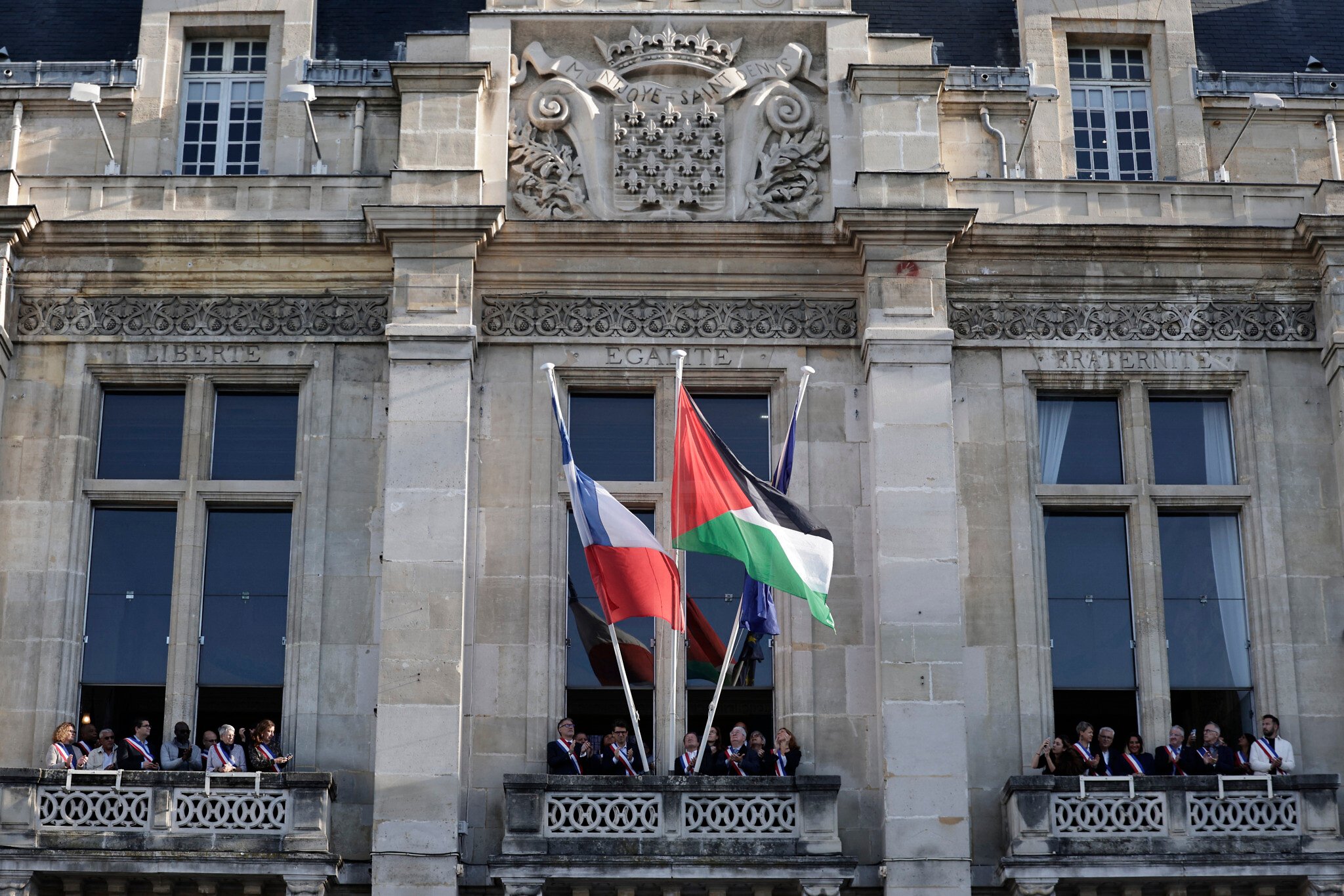 NextImg:Defying government, French town halls fly Palestinian flags to mark state recognition