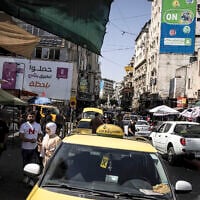 Vehicles move through congested traffic along a main street in Ramallah in the  West Bank on September 22, 2025. (JOHN WESSELS / AFP)