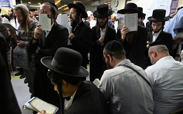 Hasidic Jewish pilgrims pray at the tomb of Rabbi Nachman, ahead of the Jewish new year of "Rosh Hashanah", in Uman, central Ukraine, on September 22, 2025. (Photo by Genya SAVILOV / AFP)