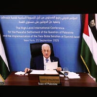 Palestinian Authority President Mahmud Abbas is displayed on a screen as he speaks remotely during a United Nations Summit on Palestinians at UN headquarters during the United Nations General Assembly (UNGA) in New York on September 22, 2025. (Ludovic MARIN / AFP)