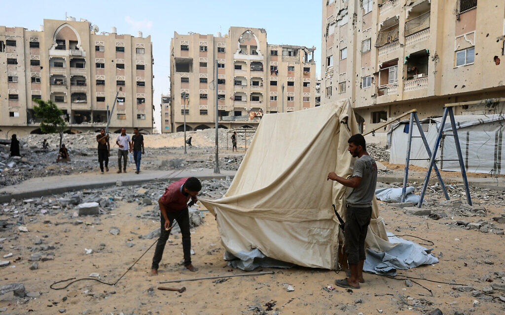 Displaced Palestinians set up a tent at the Qatari-built Hamad City residential complex in northwestern Khan Younis, in the southern Gaza Strip, on September 24, 2025. (Omar AL-QATTAA / AFP)