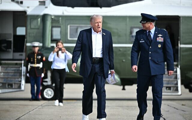 US President Donald Trump makes his way to board Air Force One before departing from Joint Base Andrews in Maryland on September 26, 2025. Trump is heading to Farmingdale, New York to attend the Ryder Cup golf competition. (Photo by Mandel NGAN / AFP)