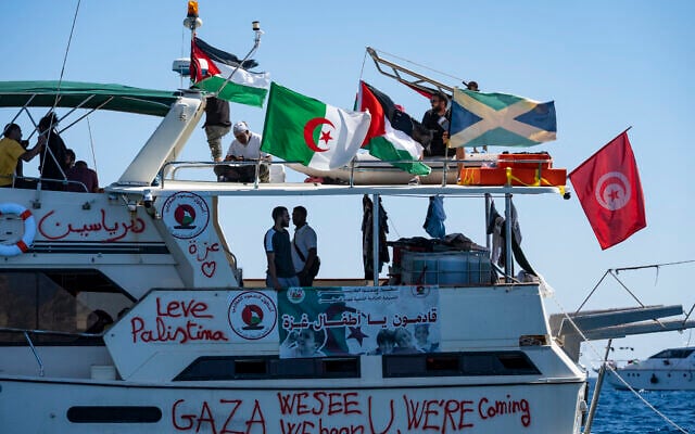 Members of the group of ships of the Global Sumud Flotilla to Gaza are seen moored at the small island of Koufonisi, south of the island of Crete, on September 26, 2025. (Photo by Eleftherios ELIS / AFP)
