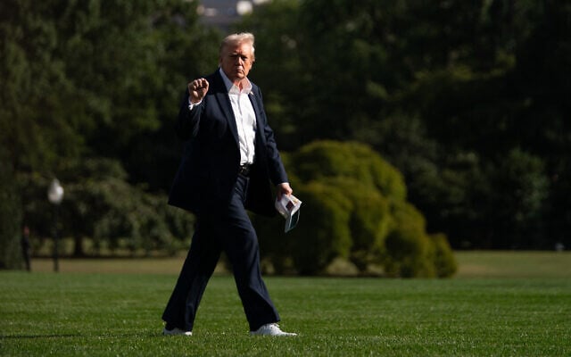 US President Donald Trump walks to the Oval Office of the White House upon return from attending the Ryder Cup golfing tournament, in Washington on September 26, 2025. (Allison Robbert/AFP)
