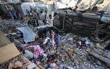 Palestinians check the damage outside a house hit by an Israeli strike in the Nuseirat  camp in the central Gaza Strip on September 27, 2025. (Photo by Eyad BABA / AFP)
