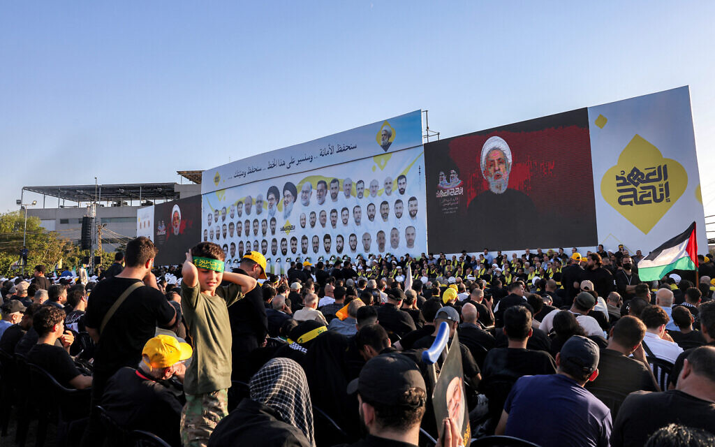 Supporters of the Lebanese Shiite movement Hezbollah attend a ceremony marking the first anniversary of Israel's assassination of their longtime leader Hassan Nasrallah in Beirut's southern suburbs on September 27, 2025. The Iran-backed group, weakened by a deadly war with Israel last year, has organised a series of commemorative events to mark Nasrallah's death. (Photo by Anwar AMRO / AFP)