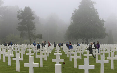 Schoolchildren visit the Colleville American military cemetery, in Colleville sur Mer, western France, June 6, 2018, on the 74th anniversary of the D-Day landing. (AP Photo/David Vincent)