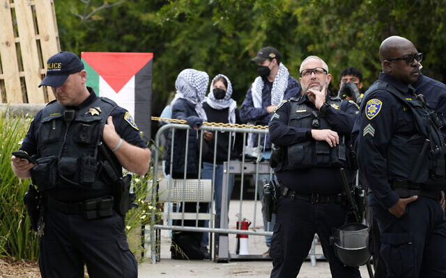 Security officers stand outside a barricade as pro-Palestinian, anti-Israel protesters gather on the campus of the University of California, Los Angeles, May 23, 2024. (AP Photo/Damian Dovarganes) Security officers stand outside a barricade as pro-Palestinian, anti-Israel protesters gather on the campus of the University of California, Los Angeles, May 23, 2024. (AP Photo/Damian Dovarganes)