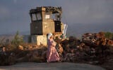 Illustrative: A Jewish settler comes to pray in the Eviatar outpost in the West Bank, July 7, 2024. (AP Photo/Ohad Zwigenberg)