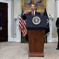 Larry Ellison, chairman of Oracle Corporation, center, speaks as US President Donald Trump, left, and Masayoshi Son, SoftBank Group CEO, listen in the Roosevelt Room at the White House, January 21, 2025, in Washington. (AP Photo/Julia Demaree Nikhinson)