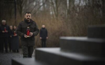 In this photo provided by the Ukrainian Presidential Press Office, Ukrainian President Volodymyr Zelensky attends a ceremony marking Holocaust Remembrance Day at the monument to Jewish victims of Nazi massacres at Babyn Yar ravine in Kyiv, Ukraine, January 27, 2025. (Ukrainian Presidential Press Office via AP)