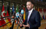 Belgium's Foreign Minister Maxime Prevot speaks with the media as he arrives for a meeting of EU foreign ministers at the European Council building in Brussels, February 24, 2025. (AP Photo/Virginia Mayo)