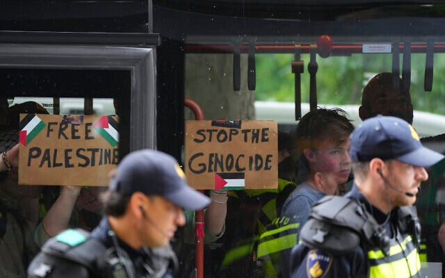 Police detain protesters during a rally in The Hague, Netherlands, June 25, 2025. (AP Photo/Peter Dejong)