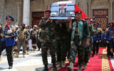 Houthi officers carry the coffin of Houthi Prime Minister Ahmed al-Rahawi, who was killed along with others in Israeli airstrikes on Thursday, out of the Shaab Mosque during his funeral in Sanaa, Yemen, Sept. 1, 2025. (AP Photo/Osamah Abdulrahman)