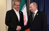 Iranian President Masoud Pezeshkian, left, and Russian President Vladimir Putin, right, shake hands during their meeting on the sidelines of the Shanghai Cooperation Organisation summit in Tianjin, China, September 1, 2025. (Alexander Kazakov, Sputnik, Kremlin Pool Photo via AP)