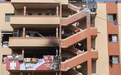 People walk up stairs to the site of an Israeli strike at Nasser Hospital, minutes before a second round of strikes hit the same spot in Khan Younis, in the southern Gaza Strip, August 25, 2025. This was one of the last photos taken by journalist Mariam Dagga, who freelanced for The Associated Press and other outlets, before she walked to the site and was killed. (AP Photo/Mariam Dagga)