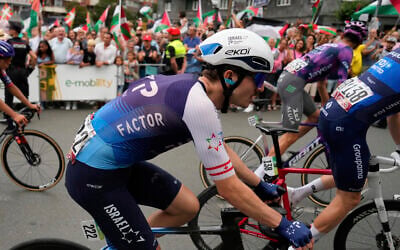 Pier-Andre Cote from the Israel Premier Tech team rides during the eleventh stage of the Spanish Vuelta cycling race, from Bilbao to Bilbao, Spain, Wednesday, Sept. 3, 2025. (AP Photo/Miguel Oses)