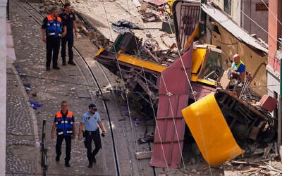 Police officers inspect the site where a tourist streetcar derailed and crashed in Lisbon, Portugal, Thursday, Sept. 4, 2025. (AP/Armando Franca) Police officers inspect the site where a tourist streetcar derailed and crashed in Lisbon, Portugal, Thursday, Sept. 4, 2025. (AP/Armando Franca)