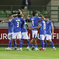 Israel's players celebrate their side's third goal, scored by Israel's Tai Baribo, during a group 1, World Cup qualifier soccer match between Moldova and Israel at the ZImbru stadium in Chisinau, Moldova, September 5, 2025. (AP Photo/Aurel Obreja)