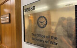 A new sign hangs at the Pentagon after US President Donald Trump signed an executive order aiming to rename the Department of Defense the Department of War in Washington, Sept. 5, 2025. (AP Photo/Mike Pesoli)