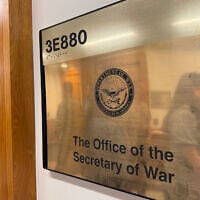 A new sign hangs at the Pentagon after US President Donald Trump signed an executive order aiming to rename the Department of Defense the Department of War in Washington, Sept. 5, 2025. (AP Photo/Mike Pesoli)