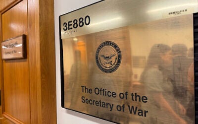A new sign hangs at the Pentagon after US President Donald Trump signed an executive order aiming to rename the Department of Defense the Department of War in Washington, Sept. 5, 2025. (AP Photo/Mike Pesoli)