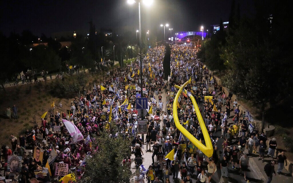 Relatives and supporters of hostages held in the Gaza Strip attend a rally demanding their release from Hamas captivity and calling for an end to the war, in Jerusalem, September 6, 2025. (AP/Mahmoud Illean)