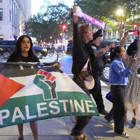 Pro-Palestinian protesters gather near a restaurant entrance after US President Donald Trump arrived for dinner near the White House, September 9, 2025, in Washington. (AP Photo/Alex Brandon)